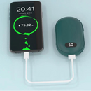 Hand warmer with 10000mAh capacity charging a smartphone on a light blue background