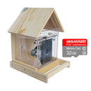 A wooden house-shaped camera enclosure with a clear acrylic front door and a visible motor mechanism inside, shown on a white background with a CamNami 32GB memory card graphic overlay on the right.